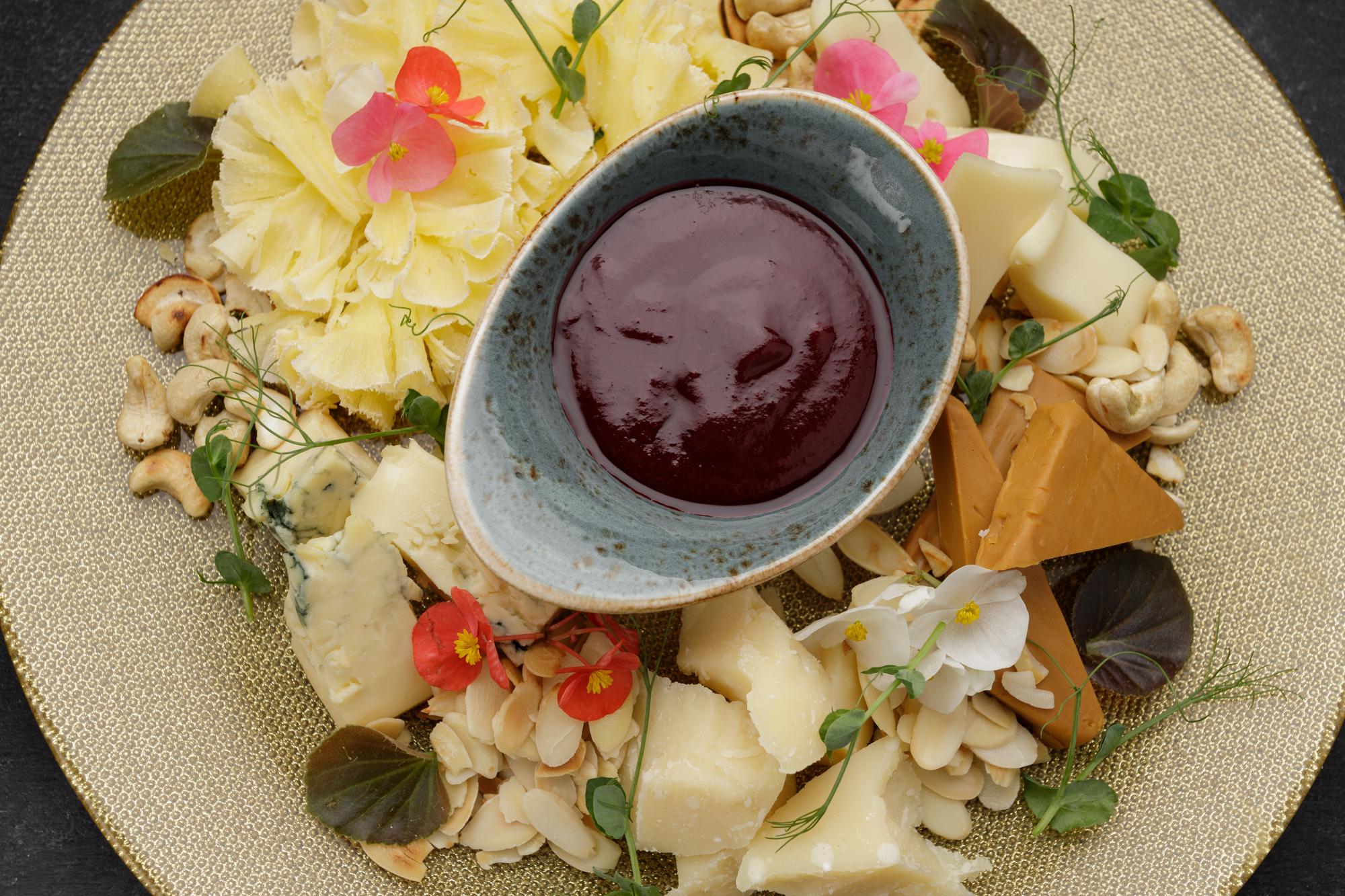 Dessert with edible flowers and sauce